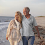 Sand landscape with blue sky, clouds and water